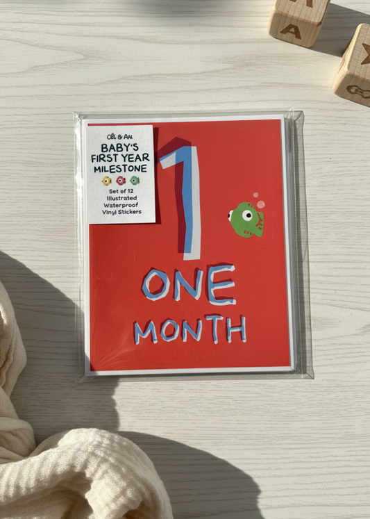 Baby milestone card for one month with wooden letters on a light surface